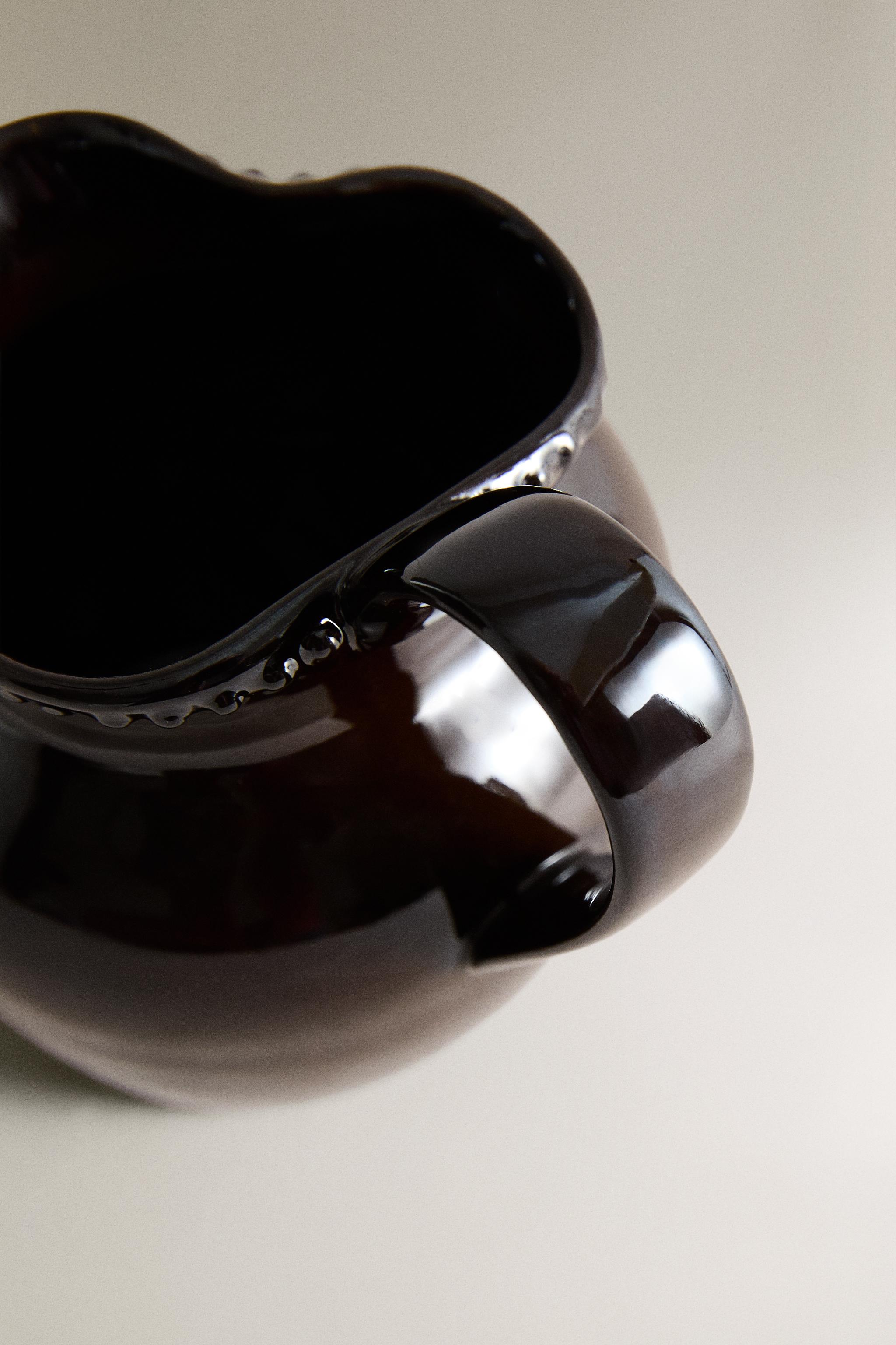 RAISED DESIGN STONEWARE JUG